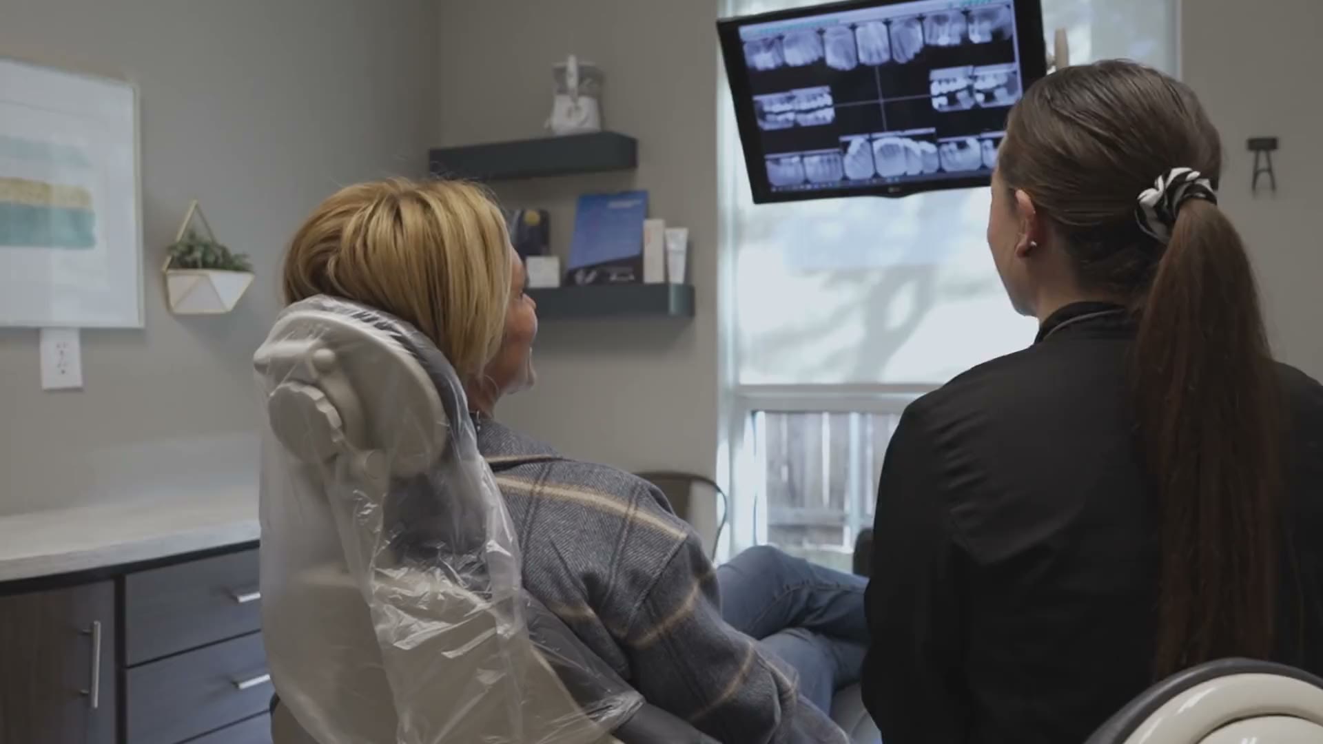 A patient and clinician reviewing digital X-rays at The Dental Studio of Midland