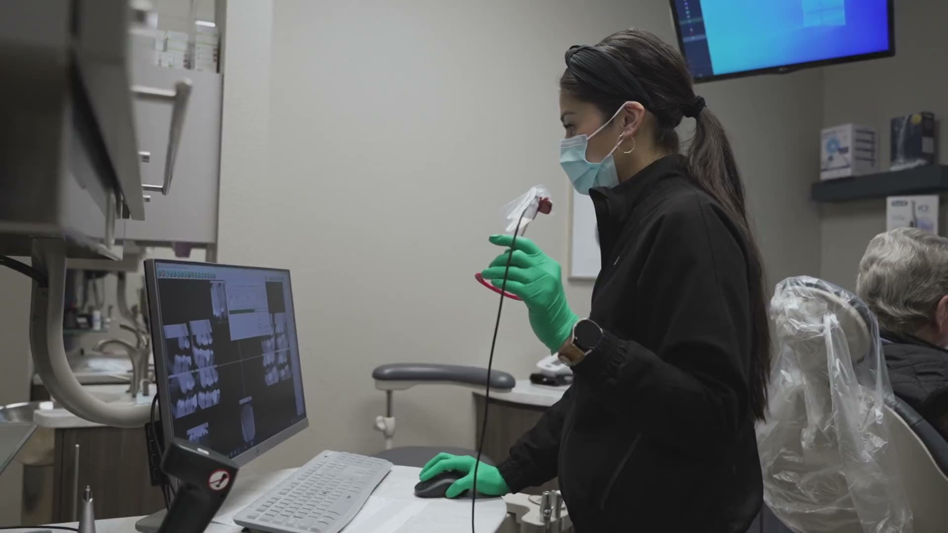 A clinician preparing digital imaging equipment at The Dental Studio of Midland