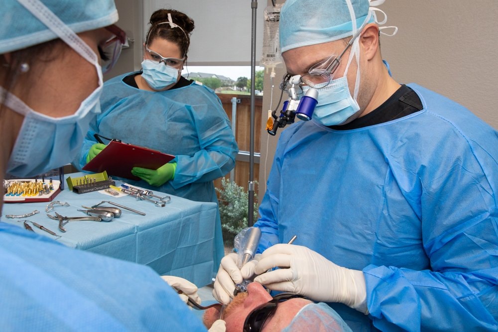 Dental Studio of Midland doctors performing implant surgery in the office surgical suite